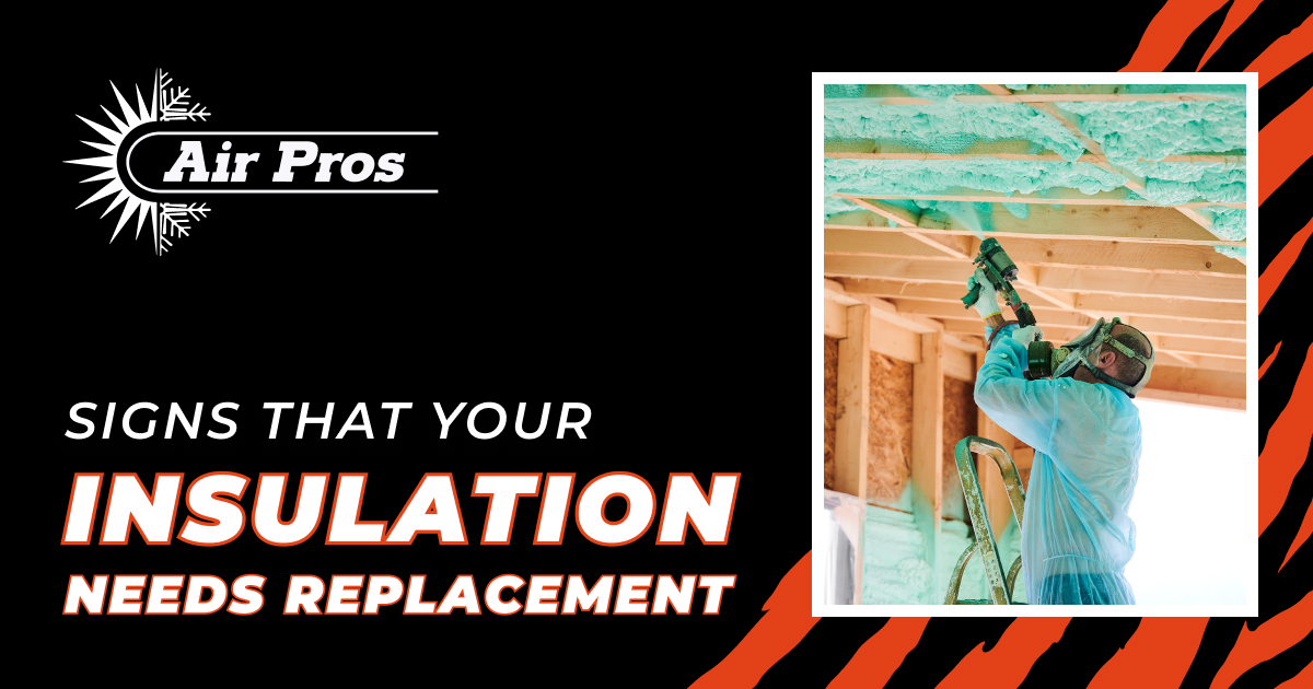 A worker in protective gear sprays insulation onto a building’s ceiling, highlighting Air Pros’ expert solutions for your insulation needs and timely insulation replacement.