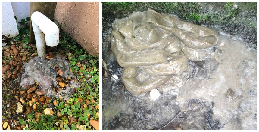 Clumps of gray, greasy material are shown on the ground near drainage pipes, likely depicting sewer fatbergs or sludge from a clogged drain line.