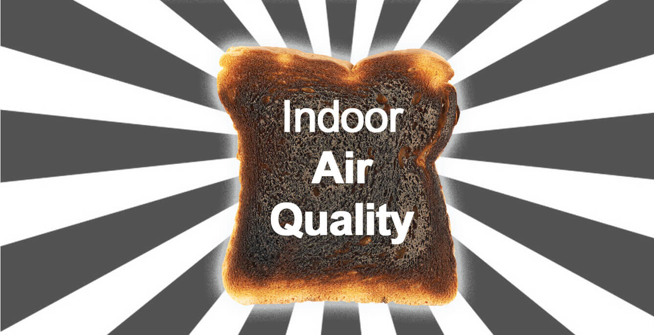A piece of burnt toast with "Indoor Air Quality" written on it, highlighting the impact of air pollution, set against a striking black and white radial background.